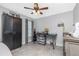 Bedroom offers tile flooring, ceiling fan, window and spacious closet at 185 Hercules Dr, Rotonda West, FL 33947