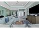 Open-concept living space with a dining area, a comfortable sofa, and stylish coastal decor at 185 Hercules Dr, Rotonda West, FL 33947