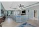 Expansive living space with open layout showcasing dining area, sofa, and stylish coastal decor at 185 Hercules Dr, Rotonda West, FL 33947