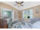 Cozy office featuring a fan, two upholstered chairs, and a writing desk at 185 Hercules Dr, Rotonda West, FL 33947