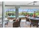 A view from the covered patio out to the pool and lounge area at 185 Hercules Dr, Rotonda West, FL 33947