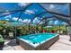 Outdoor pool and patio featuring clear blue skies and lush greenery at 185 Hercules Dr, Rotonda West, FL 33947