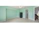 Bedroom with neutral tile flooring, and access to an adjacent bathroom and hallway at 1865 Rival Ter, North Port, FL 34286