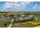 Aerial view of a clubhouse, landscaping, parking, and other community ammenities at 1865 Rival Ter, North Port, FL 34286
