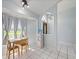 Bright dining area with a window view, tile floor and stylish lighting at 1865 Rival Ter, North Port, FL 34286