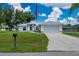 Charming single-story home featuring a well-manicured lawn and an attached two-car garage at 1865 Rival Ter, North Port, FL 34286