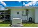 A generator, along with a meter box, on the exterior wall of the house at 1865 Rival Ter, North Port, FL 34286