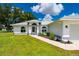 Close up of the front entrance and the attached two-car garage on this single-story home at 1865 Rival Ter, North Port, FL 34286