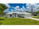 Charming single Gathering home with manicured lawn and attached two car garage at 1865 Rival Ter, North Port, FL 34286