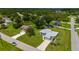 A well-manicured front lawn and tidy landscaping frame this cozy home in a serene residential area at 1865 Rival Ter, North Port, FL 34286