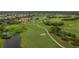Scenic aerial shot of the golf course, featuring manicured greens and beautiful landscaping at 1865 Rival Ter, North Port, FL 34286