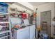 Utility room with washer, dryer and plentiful storage shelves at 1865 Rival Ter, North Port, FL 34286
