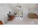 Spacious living room with sliding glass doors, lots of light, and tile floors at 1865 Rival Ter, North Port, FL 34286