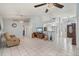 Spacious living room with tile floors, ceiling fans, and neutral décor at 1865 Rival Ter, North Port, FL 34286