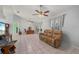 Spacious living room with neutral color palette, tile flooring, and plenty of natural light at 1865 Rival Ter, North Port, FL 34286