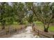 Beautiful park featuring a paved path, mature trees, and a bicycle rack at 1865 Rival Ter, North Port, FL 34286