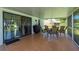 Enjoy outdoor dining in this spacious covered patio with tile flooring and screen surround at 1865 Rival Ter, North Port, FL 34286