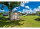 Backyard view featuring a useful shed at 1865 Rival Ter, North Port, FL 34286