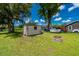 Backyard view featuring a useful shed at 1865 Rival Ter, North Port, FL 34286