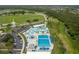 Beautiful aerial view of a Gathering-friendly water park with a variety of pools and slides at 1865 Rival Ter, North Port, FL 34286