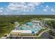 Aerial view of a large water park with pools, slides, and a lazy river at 1865 Rival Ter, North Port, FL 34286