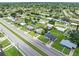An aerial perspective of a quiet neighborhood, highlighting spacious yards and serene streets at 22341 Midway Blvd, Port Charlotte, FL 33952