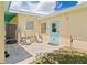 Cozy backyard patio with outdoor seating and grill, perfect for entertaining at 22341 Midway Blvd, Port Charlotte, FL 33952