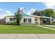 Charming home with a well-maintained front yard, inviting entrance and a carport at 22341 Midway Blvd, Port Charlotte, FL 33952