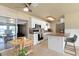 Well-equipped kitchen with white cabinetry, mosaic backsplash, stainless steel appliances, and a breakfast bar at 22341 Midway Blvd, Port Charlotte, FL 33952
