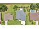 Bird's-eye view of a well-kept home with a backyard patio, pool and meticulously landscaped surroundings at 25062 Palisade Rd, Punta Gorda, FL 33983