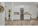 Dry bar area featuring white cabinetry, a beverage refrigerator, and stylish decor at 25062 Palisade Rd, Punta Gorda, FL 33983