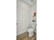 Bathroom featuring a toilet and modern floating shelves at 25062 Palisade Rd, Punta Gorda, FL 33983