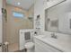 Bathroom featuring a glass enclosed shower, a vanity with marble countertops and wood look flooring at 25062 Palisade Rd, Punta Gorda, FL 33983