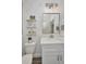Bathroom featuring a toilet, a vanity with marble countertops and wood look flooring at 25062 Palisade Rd, Punta Gorda, FL 33983