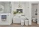 Luxurious bathroom features a freestanding tub, a decorative light fixture, and a separate toilet room at 25062 Palisade Rd, Punta Gorda, FL 33983