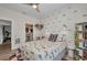 Bedroom with colorful bedding, car-themed decor, a ceiling fan, and a closet with ample storage space at 25062 Palisade Rd, Punta Gorda, FL 33983