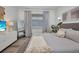 Bedroom featuring a neutral color scheme, floor mirror, and soft natural light at 25062 Palisade Rd, Punta Gorda, FL 33983