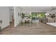 Open concept dining area featuring a modern table with seating for six and sliding doors to the lanai at 25062 Palisade Rd, Punta Gorda, FL 33983