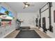 Bright workout room featuring a treadmill, TV, and weight training equipment at 25062 Palisade Rd, Punta Gorda, FL 33983