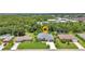 Charming home featuring a well-manicured lawn, complemented by tropical landscaping and a two-car garage at 25062 Palisade Rd, Punta Gorda, FL 33983
