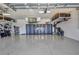 Well-maintained garage with epoxy flooring, storage cabinets, and plenty of space for vehicles at 25062 Palisade Rd, Punta Gorda, FL 33983