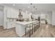 Large kitchen island with seating, pendant lighting, and ample space, perfect for entertaining at 25062 Palisade Rd, Punta Gorda, FL 33983