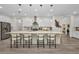 Spacious kitchen island features seating for four, stylish pendant lighting, and plenty of storage at 25062 Palisade Rd, Punta Gorda, FL 33983