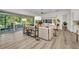Bright living area with sleek console, large sliding glass doors, and access to the patio at 25062 Palisade Rd, Punta Gorda, FL 33983