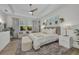 Bright main bedroom with tray ceilings, neutral tones, and serene natural light at 25062 Palisade Rd, Punta Gorda, FL 33983
