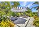 Outdoor space featuring comfortable lounge chairs, a BBQ grill, and a fire pit providing ample opportunities for outdoor enjoyment at 25062 Palisade Rd, Punta Gorda, FL 33983