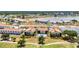Beautiful aerial view of condo community with a pool and golf course nearby at 26336 Nadir Rd # 10, Punta Gorda, FL 33983