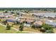 Beautiful aerial view of condo community with a pool and golf course nearby at 26336 Nadir Rd # 10, Punta Gorda, FL 33983
