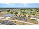 Aerial view of the condos overlooking the beautiful golf course and ponds at 26336 Nadir Rd # 10, Punta Gorda, FL 33983