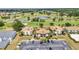 Aerial view of the condos overlooking the beautiful golf course and ponds at 26336 Nadir Rd # 10, Punta Gorda, FL 33983